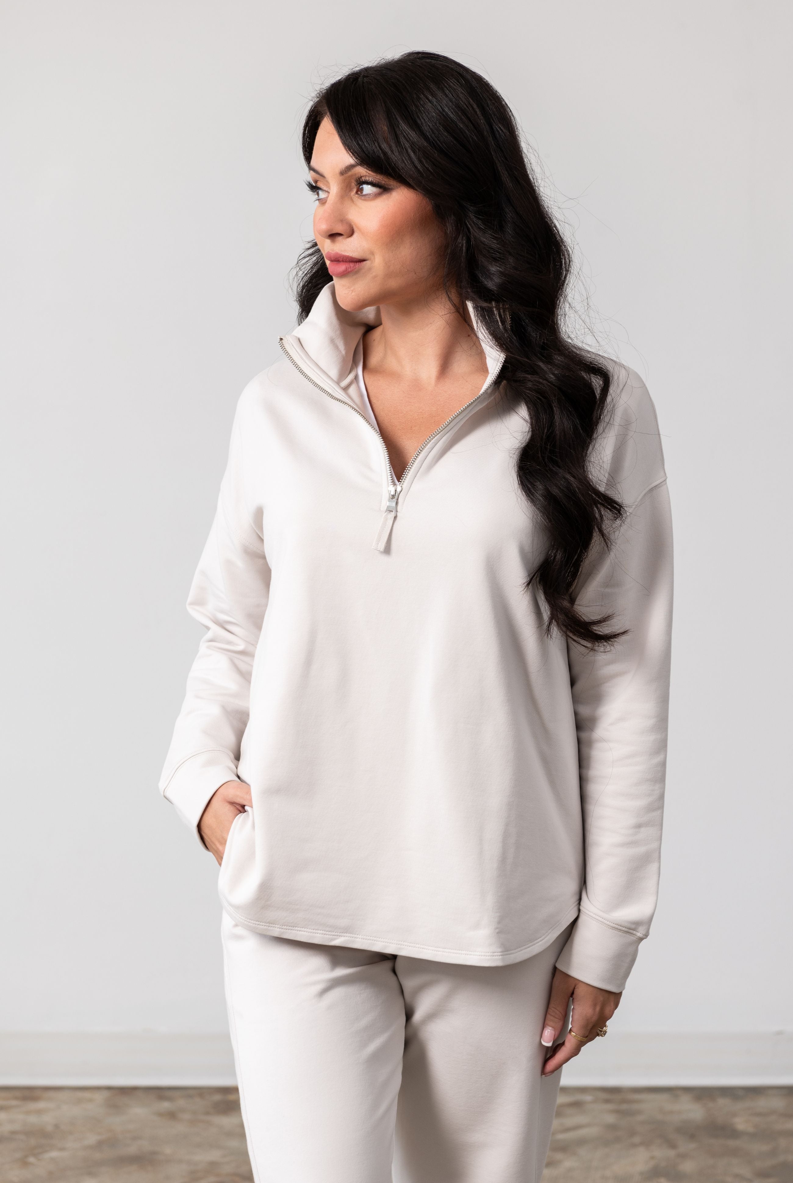 Women shown wearing a Beige Quarter zip pullover